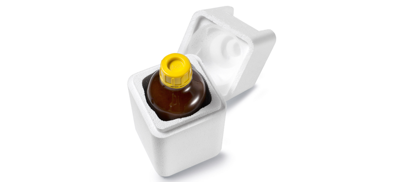 Una caja de seguridad blanca que contiene un frasco de laboratorio